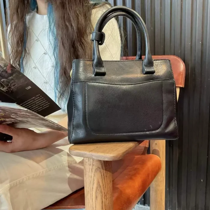 Handmade vegetable-tanned leather shoulder and crossbody bag in classic black