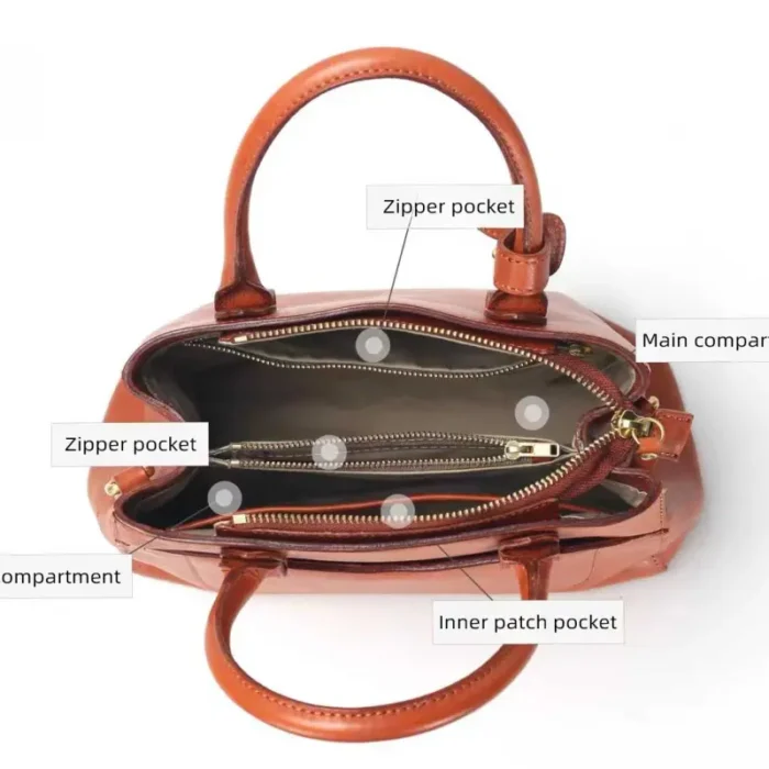 Interior view of vegetable-tanned leather bag with 2 main compartments and zipper pocket