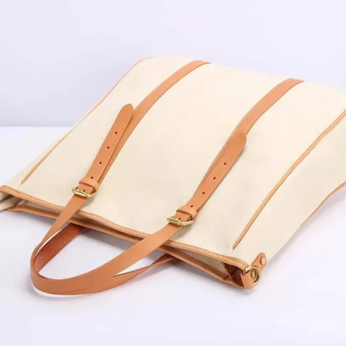 Original Canvas & Leather Tote Bag with adjustable wrist strap for comfortable long-distance carry