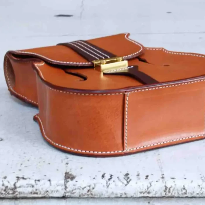 Bottom view showing the structured base and detailed stitching of the handcrafted leather backpack
