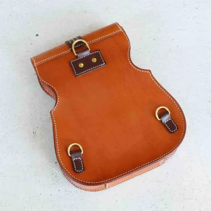 Back view of handmade violin-inspired leather backpack with adjustable straps