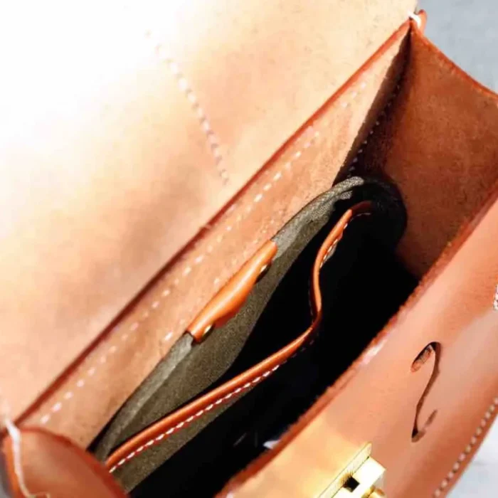 Interior view of vegetable-tanned leather backpack with slip pocket for essentials