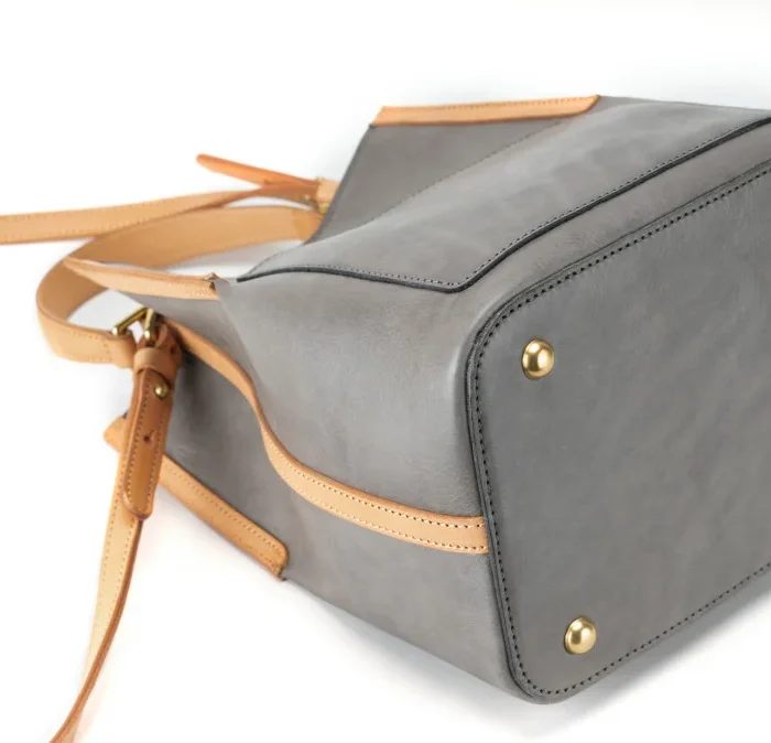 High-quality hardware details on handcrafted vegetable-tanned leather contrast bag