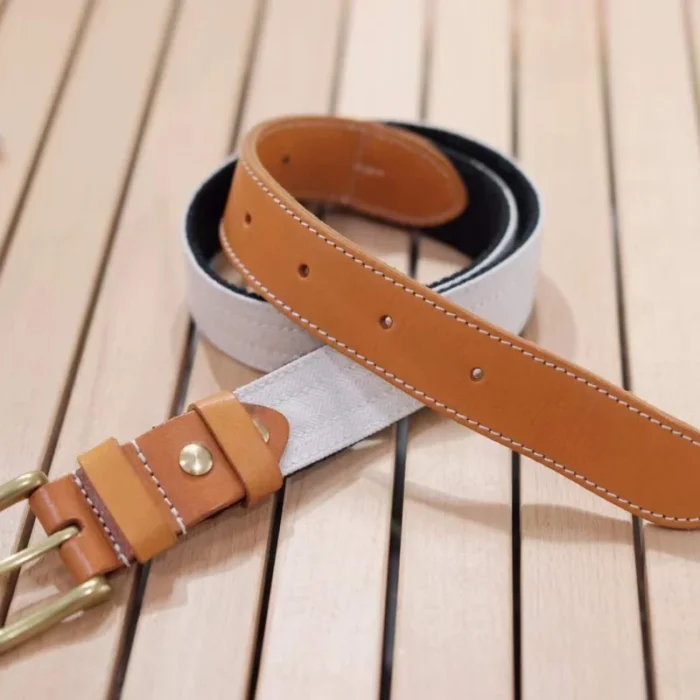 white canvas and vegetable-tanned leather belt with brass buckle for fresh summer outfits