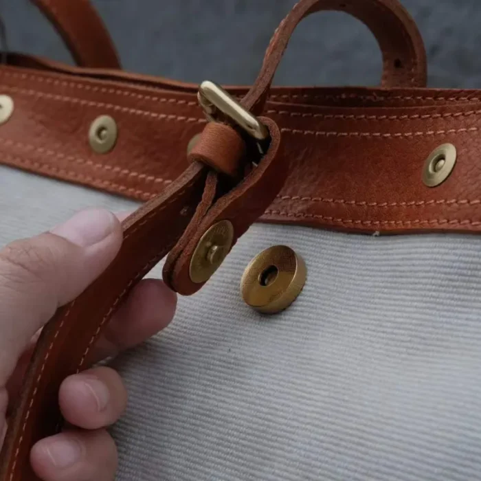 Magnetic snap closure on Canvas Leather Shoulder Bag