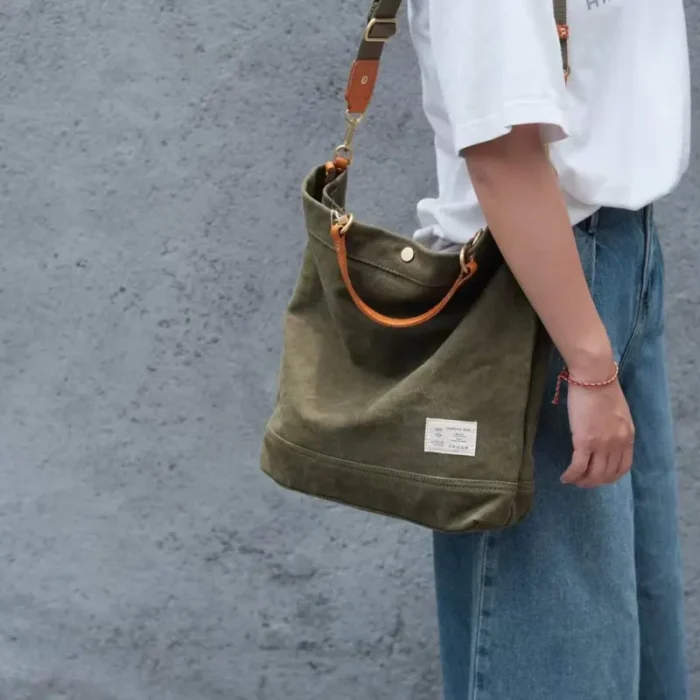 Model carrying Handmade Vintage Tote Bag on shoulder – Olive Green