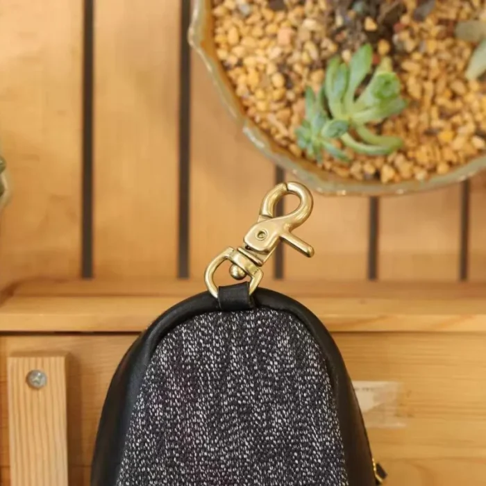 Mini Backpack Charm in Pepper Black, small vegetable-tanned leather bag with solid brass hardware