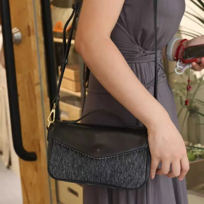 Tucker Yellow Pepper Salt bag worn crossbody, highlighting security and mobility