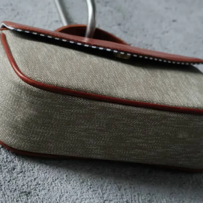Pepper Salt Canvas Crossbody Bag standing upright, showcasing stability and structure