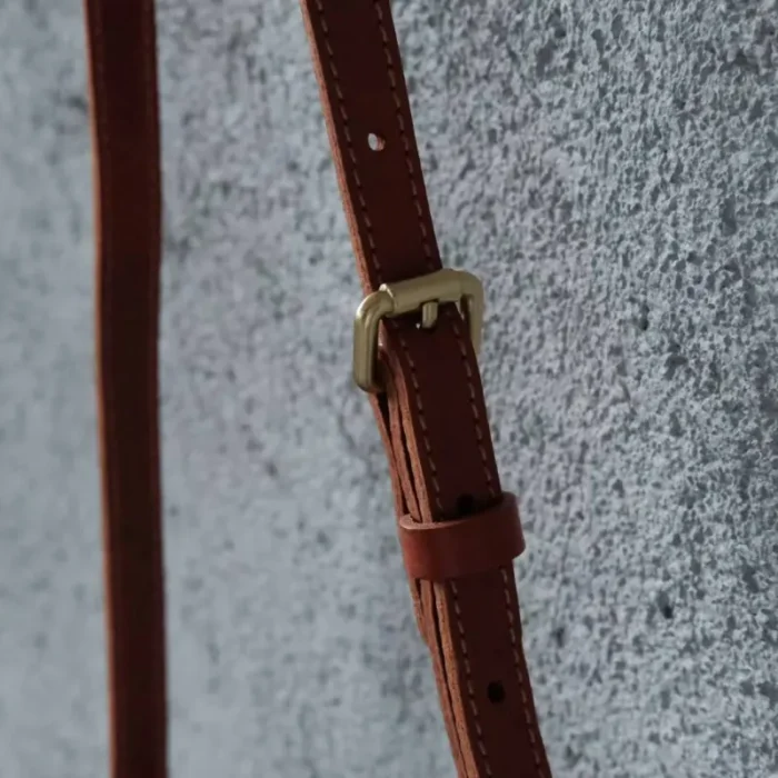 Long view of the adjustable strap on the 3-Way Pepper Salt Canvas Bag