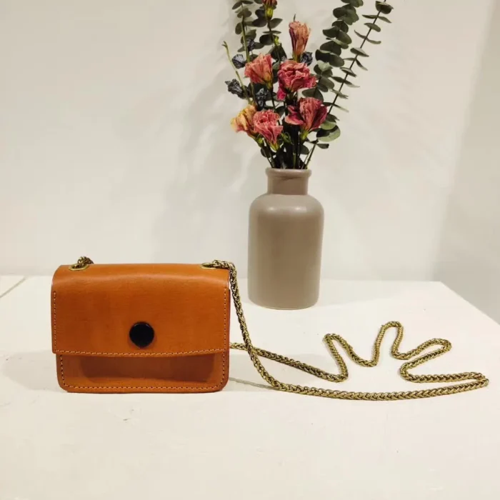 Vegetable-Tanned Leather Mini Crossbody Bag in Sunset Yellow, showcasing the vibrant, joyful energy of the handcrafted pouch.