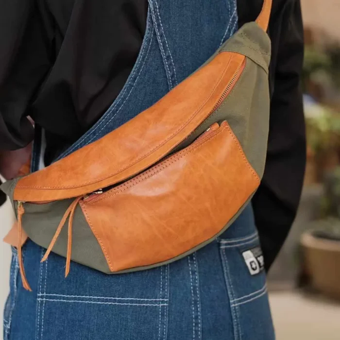 Man wearing Military Green Canvas Leather Sling Bag as a crossbody for street style.
