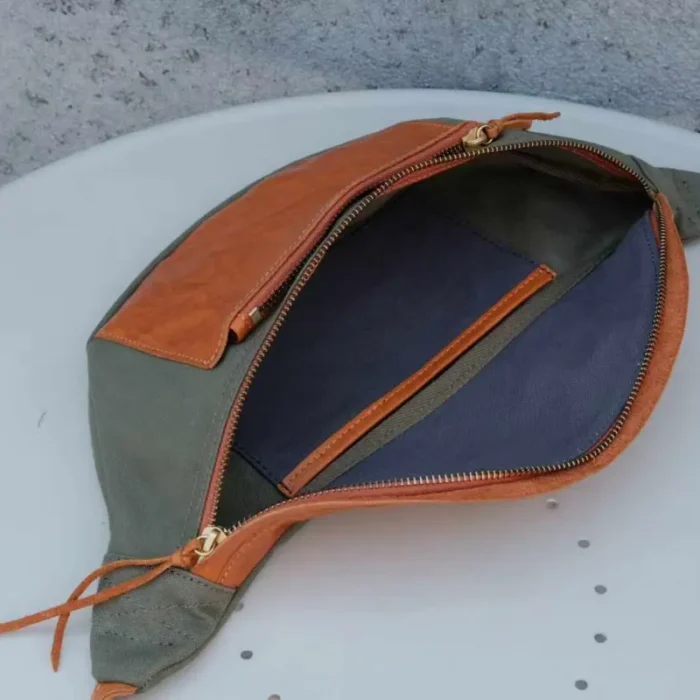 Interior organization of Canvas Leather Sling Bag, showing exterior zipper pocket.