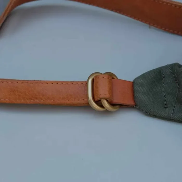 Close-up of the Military Green Canvas Leather Sling Bag, perfect for workwear.