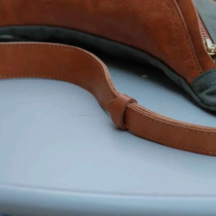Close-up of the Military Green Canvas Leather Sling Bag, perfect for workwear.