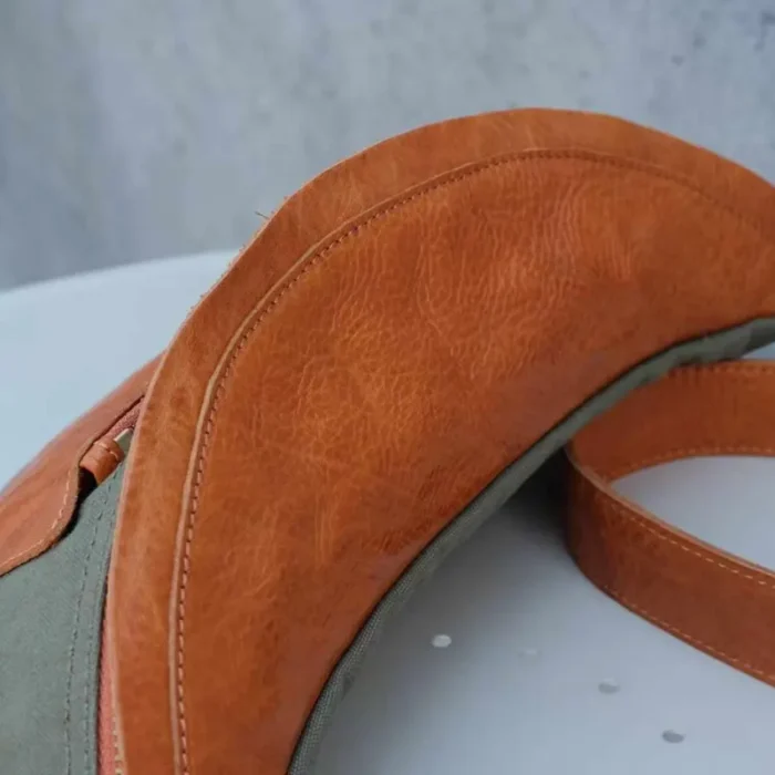 Close-up of the Military Green Canvas Leather Sling Bag, perfect for workwear.