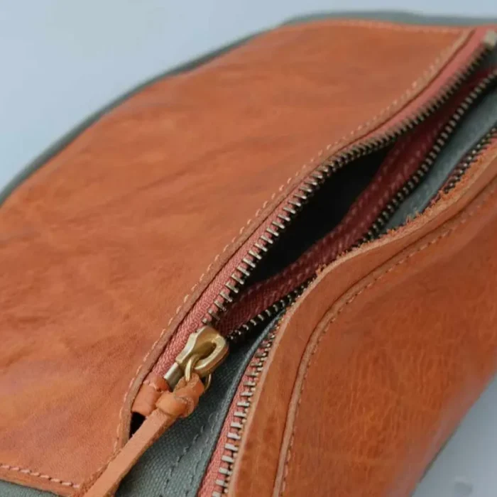 Close-up of the Military Green Canvas Leather Sling Bag, perfect for workwear.