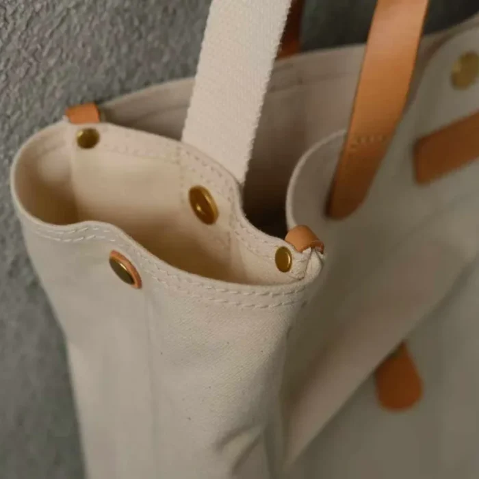 Detailed side pocket and profile of the organized commuter tote