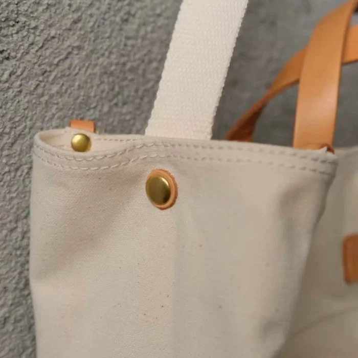 Detailed side pocket and profile of the organized commuter tote