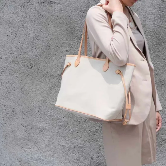Casual single-shoulder carry of the lightweight canvas tote