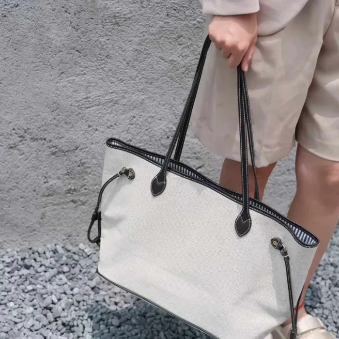 Elegant hand-carry style of the Veg-Tanned Leather Trim Tote