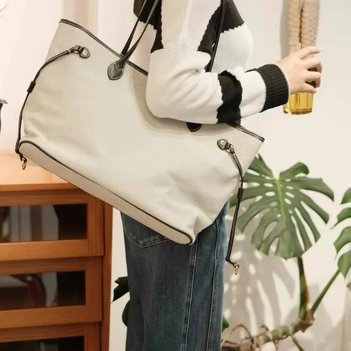 Casual single-shoulder carry of the lightweight canvas tote