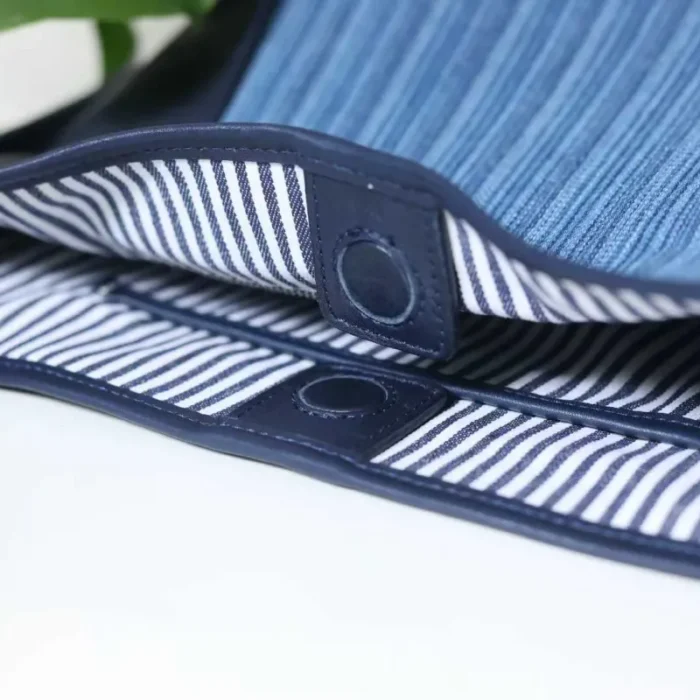 Close-up of the secure magnetic snap closure on the Striped Denim Leather Shoulder Bag, showing easy access.