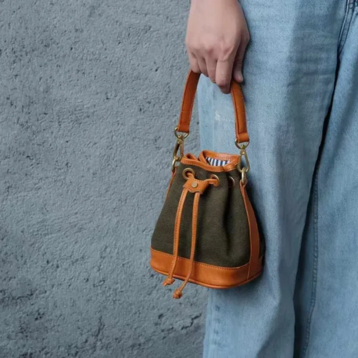 Full view of the unique Olive Green Canvas Leather Mini Bucket Bag, perfect as a stylish and vibrant vintage crossbody bag accessory.
