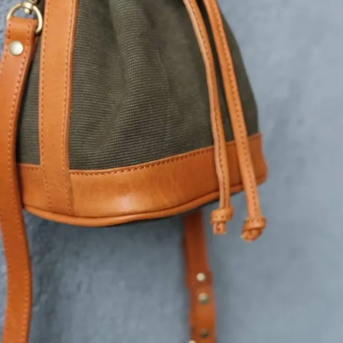 Canvas Leather Mini Bucket Bag in Coffee Brown, showcasing the stripe-woven canvas and oil waxed leather trim.