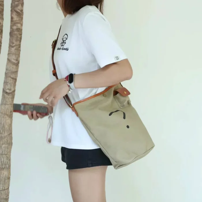 Military Green Leather Canvas Unisex Bucket Bag (front view), perfect for a rugged, utilitarian style.
