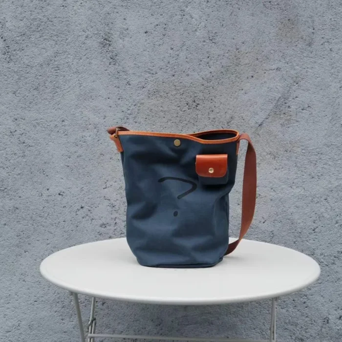 All-angle view of the large Leather Canvas Unisex Bucket Bag, showcasing the shape and Oil Waxed Leather details.