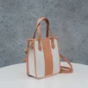 Clean White Canvas Mini Tote for a fresh aesthetic, featuring light-toned Vegetable Tanned Leather trim.