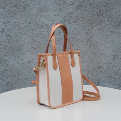 Clean White Canvas Mini Tote for a fresh aesthetic, featuring light-toned Vegetable Tanned Leather trim.