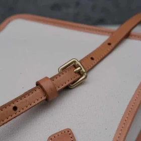 Detail of the adjustable Vegetable Tanned Leather strap on the Handmade Leather Canvas Bag.