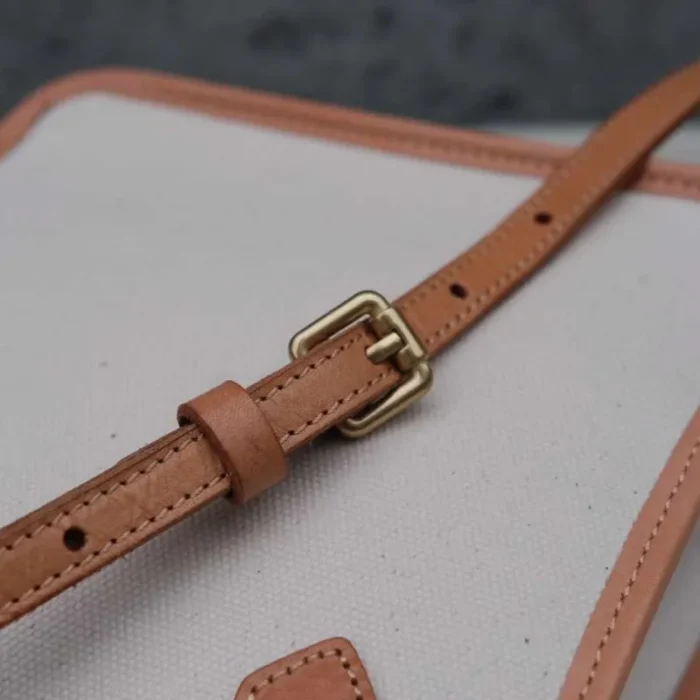 Detail of the adjustable Vegetable Tanned Leather strap on the Handmade Leather Canvas Bag.