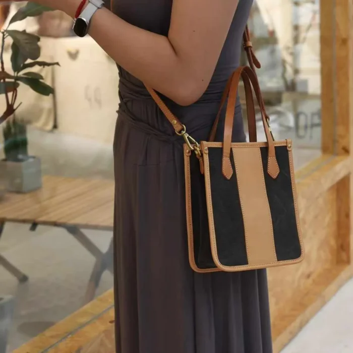 Model wearing the Canvas Mini Tote hands-free as a crossbody bag, perfect for travel or shopping.