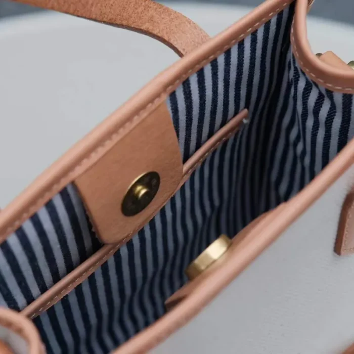 Interior view of the Canvas Mini Tote, showing the compact yet organized internal storage and lining.