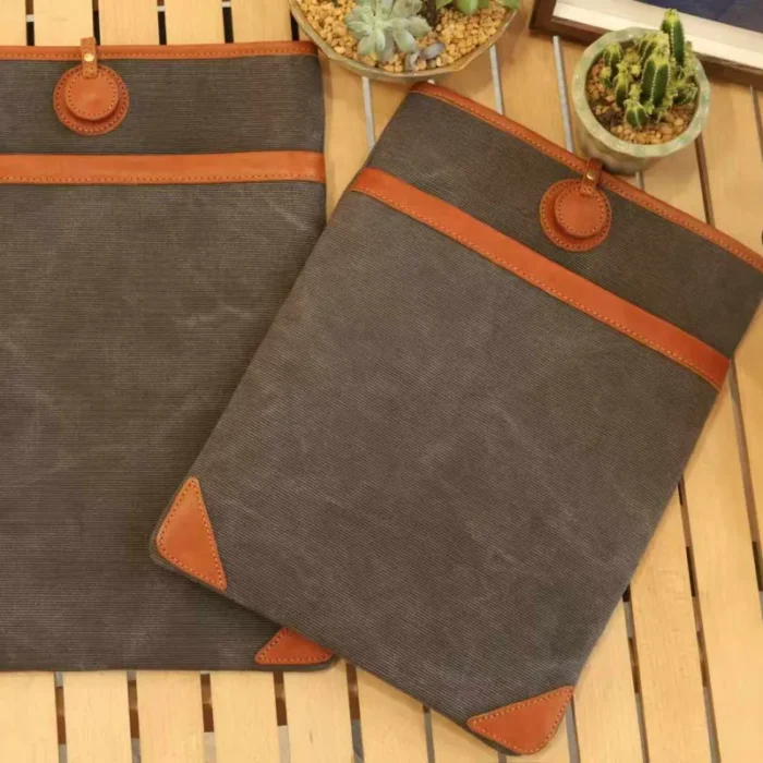 Size comparison of the 15-inch and 16-inch Lightweight Leather Canvas Sleeve models next to each other.