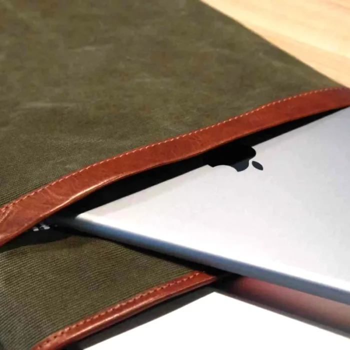 eep Grey sleeve holding both a 16-inch laptop and a large iPad, illustrating device compatibility.