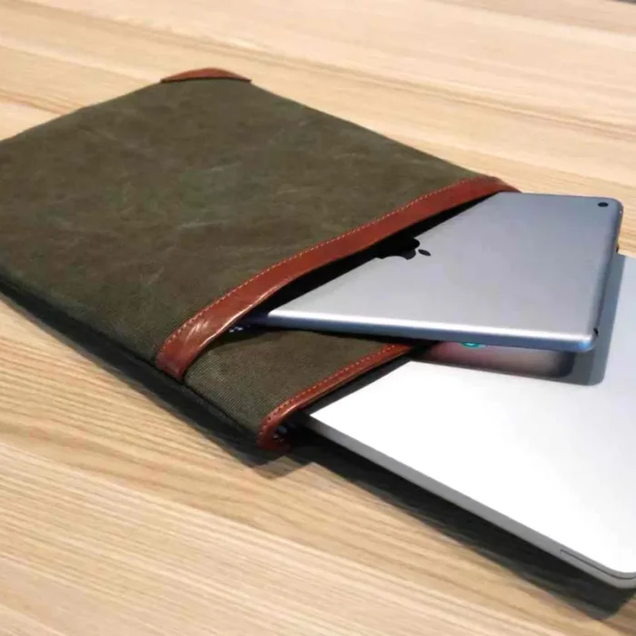 eep Grey sleeve holding both a 16-inch laptop and a large iPad, illustrating device compatibility.
