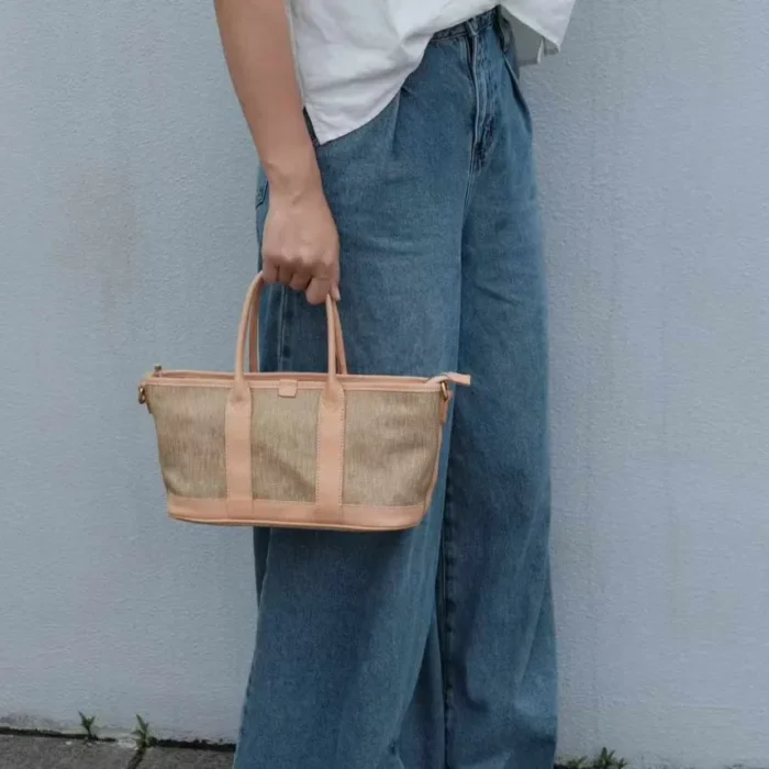 Lifestyle photo: Casual styling of the Poplar Green SYMONHO canvas tote paired with classic jeans, highlighting its everyday aesthetic.