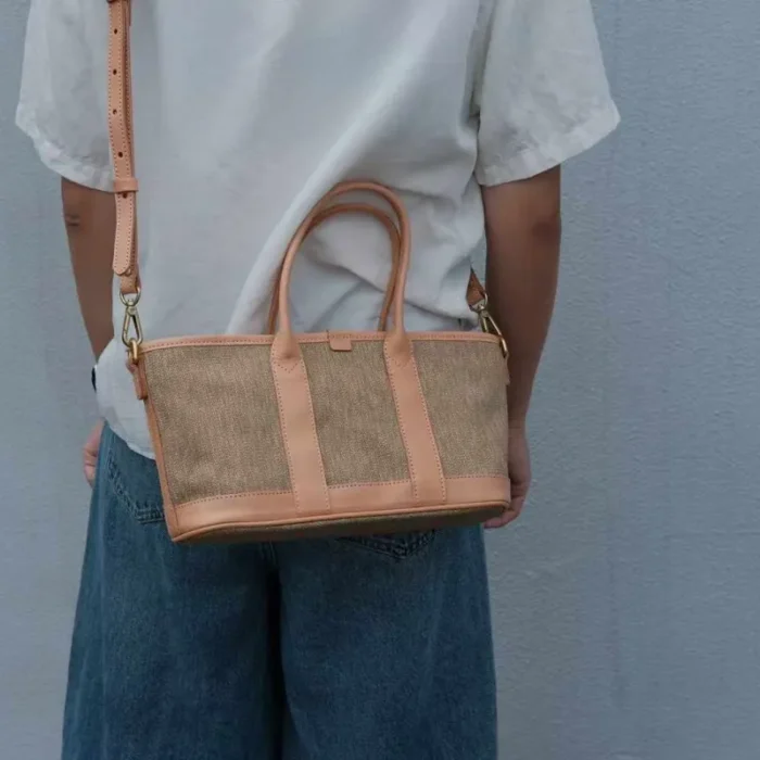 Lifestyle photo: Casual styling of the Poplar Green SYMONHO canvas tote paired with classic jeans, highlighting its everyday aesthetic.